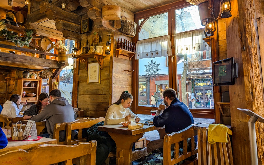 Couple dining at a rustic cafe in Zakopane, Poland.