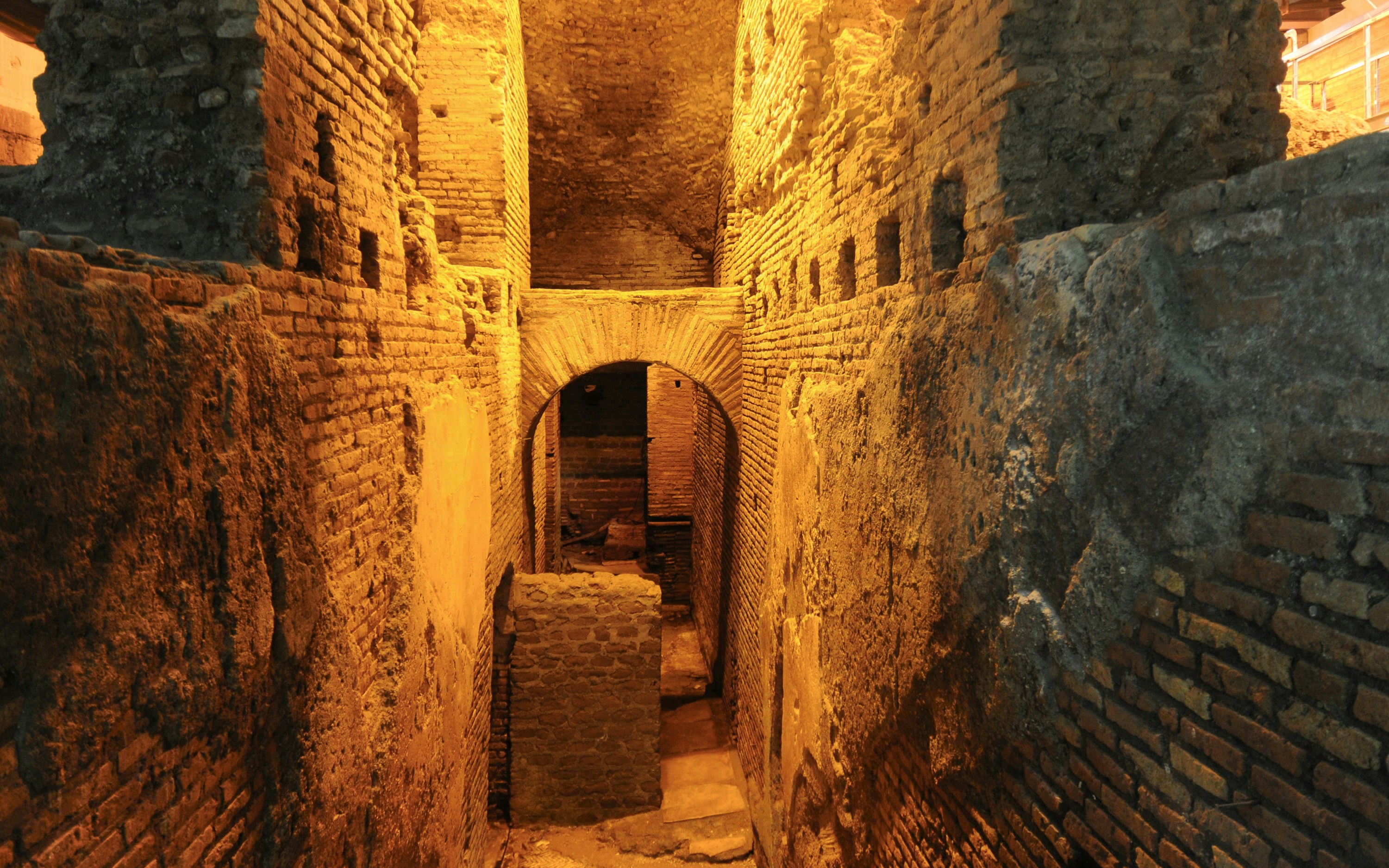 Underground ruins in Navona Square, Rome, showcasing ancient brick architecture.