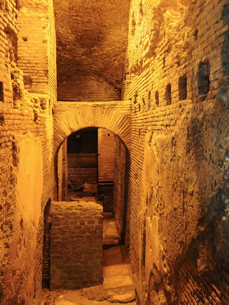 Underground ruins in Navona Square, Rome, showcasing ancient brick architecture.
