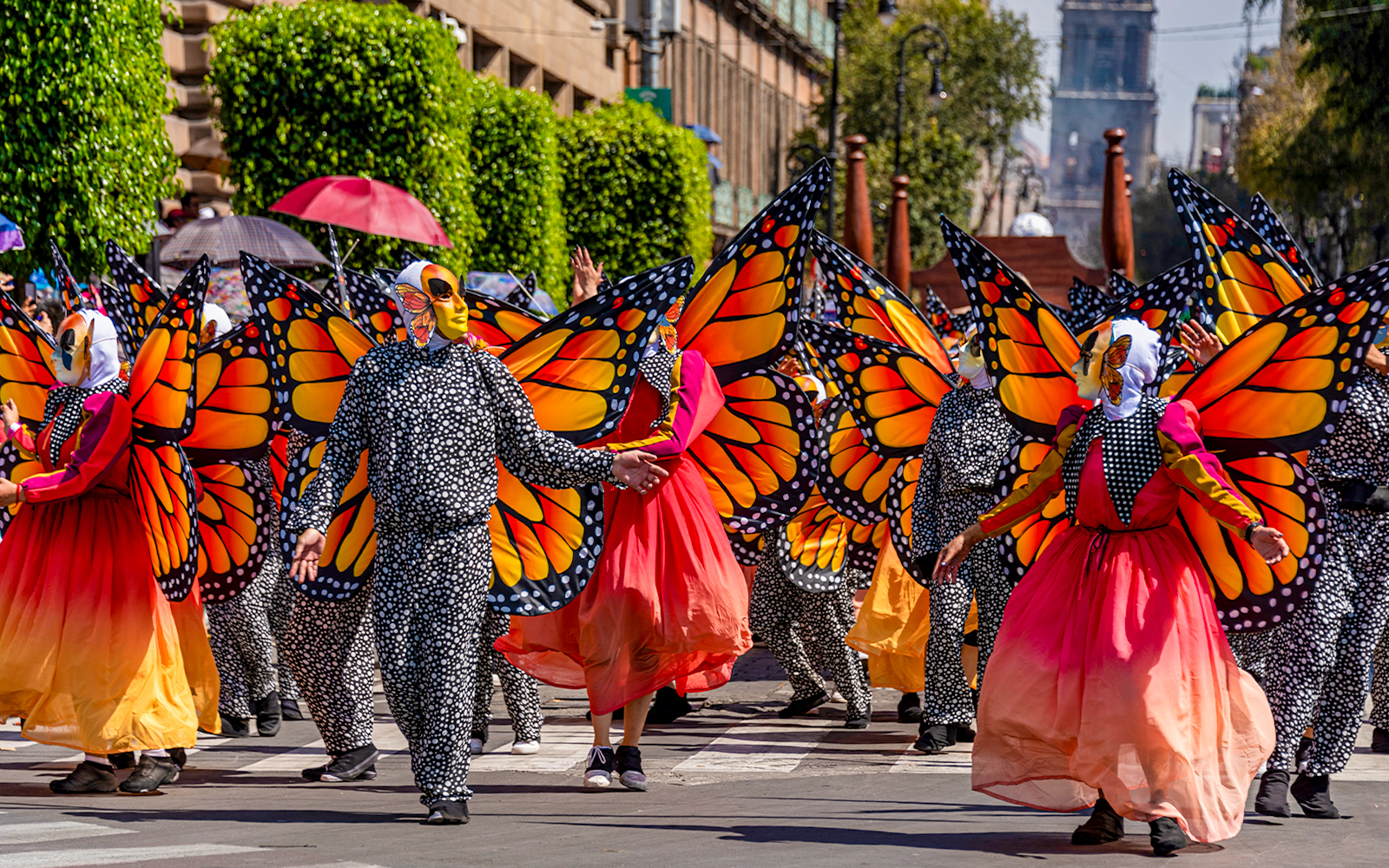 Participants in butterfly costumes at Day of the Dead parade, Mexico.