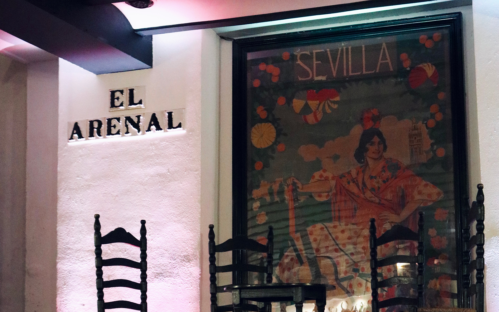 Tablao El Arenal entrance with flamenco poster in Seville.