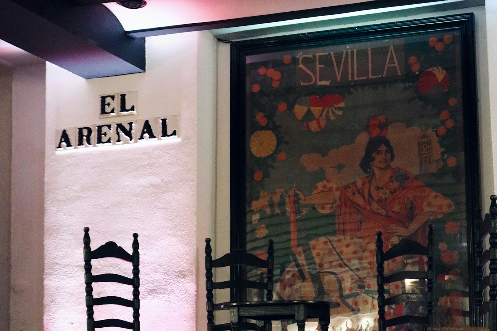 Tablao El Arenal entrance with flamenco poster in Seville.