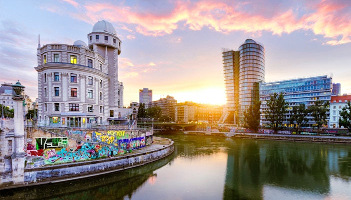Urania observatory on Vienna's Donaukanal during evening sightseeing cruise.