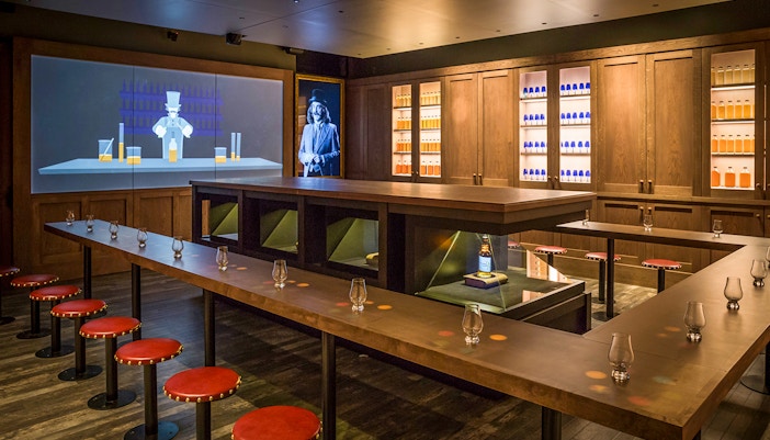 Scotch Whisky Experience tour guide explaining whisky aging process in Edinburgh.