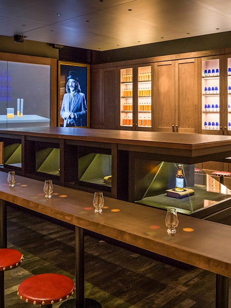 Tasting room setup at the Scotch Whisky Experience Gold Tour with glasses and whisky display.