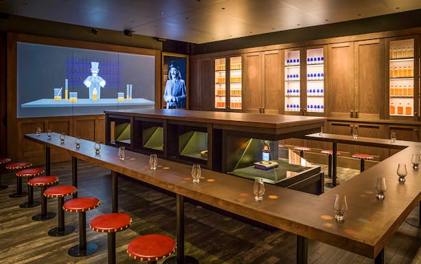 Tasting room setup at the Scotch Whisky Experience Gold Tour with glasses and whisky display.