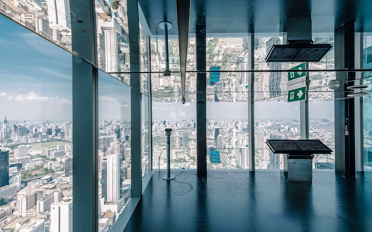 Bangkok cityscape view from Mahanakhon SkyWalk observation deck with glass floor.