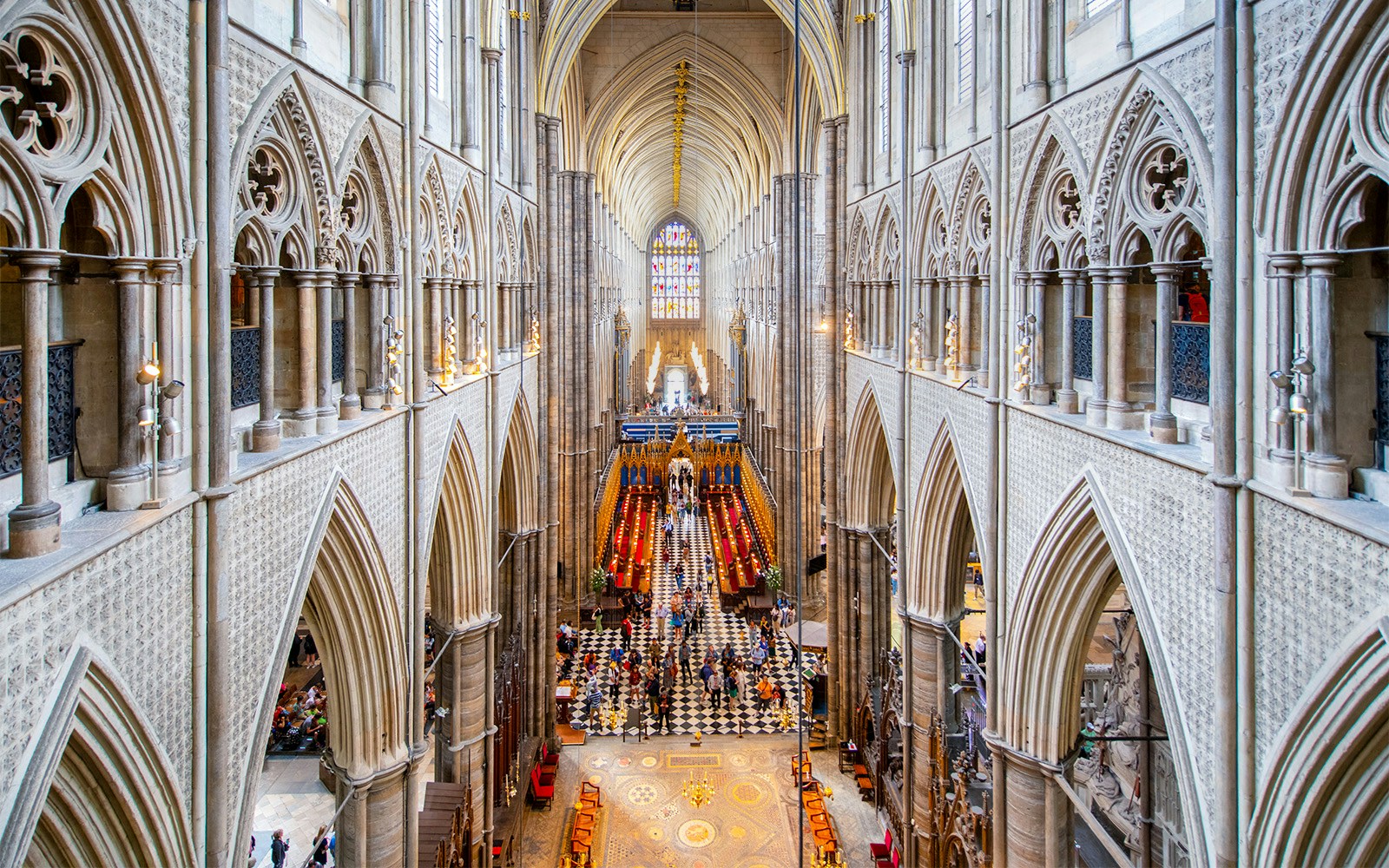 Westminster Abbey interior with view of Anglican Church architecture and stained glass.