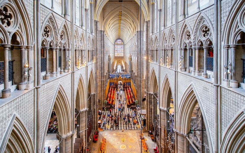 Westminster Abbey interior with view of Anglican Church architecture and stained glass.