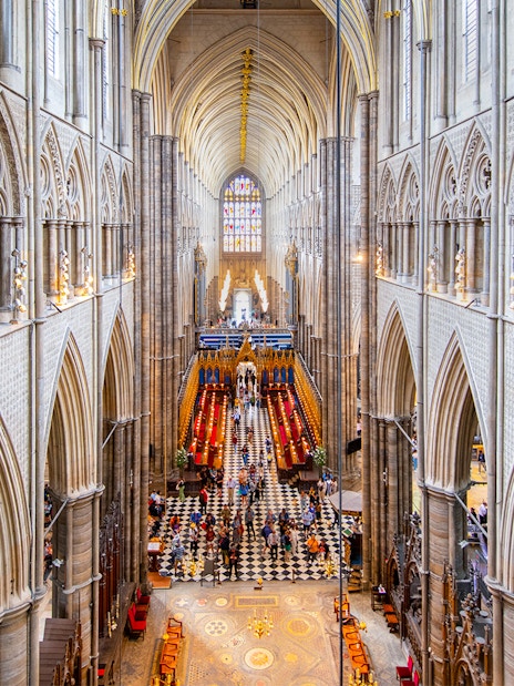 Westminster Abbey interior with view of Anglican Church architecture and stained glass.