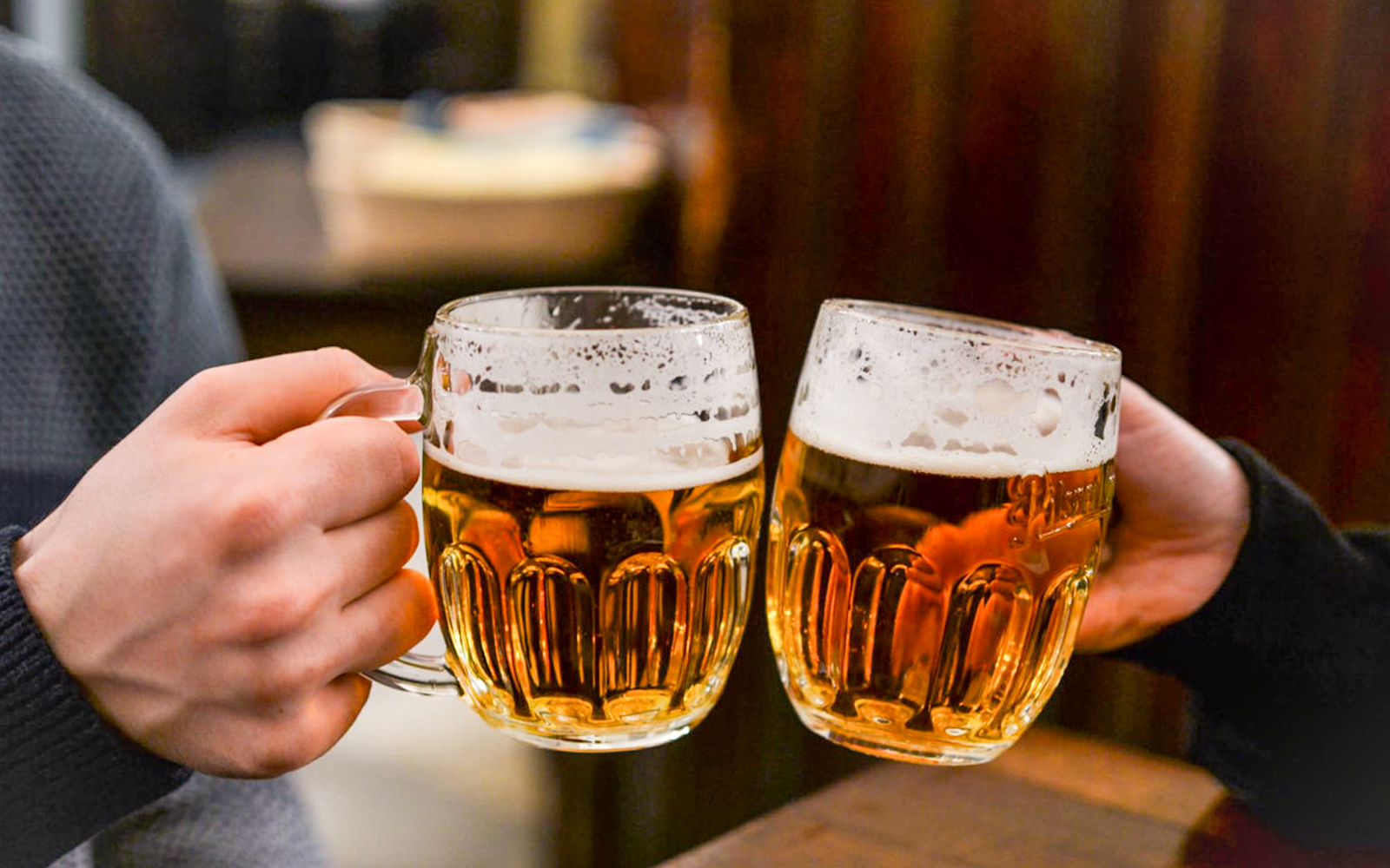 Cheers with beer mugs 