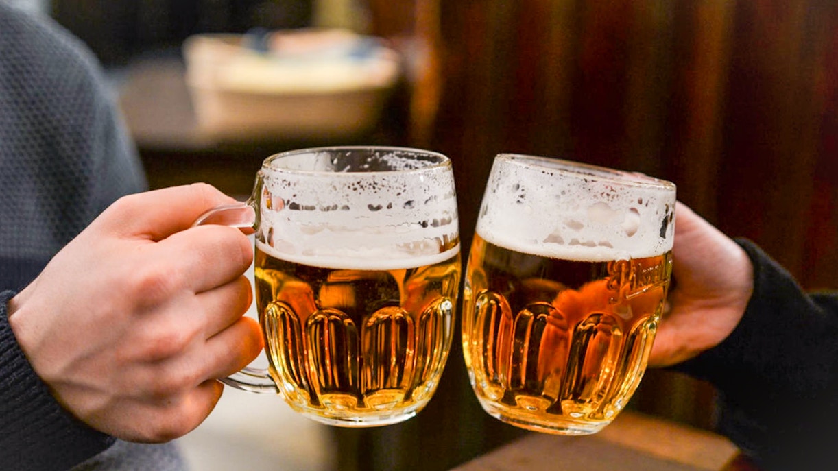 Cheers with beer mugs