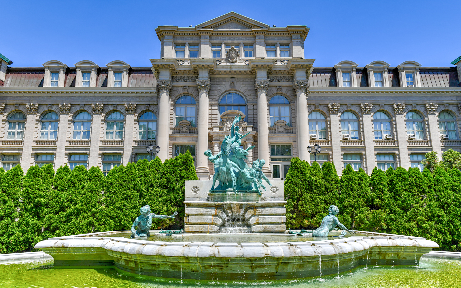 Fountain and statues in front of Mertz Library at New York Botanical Garden.