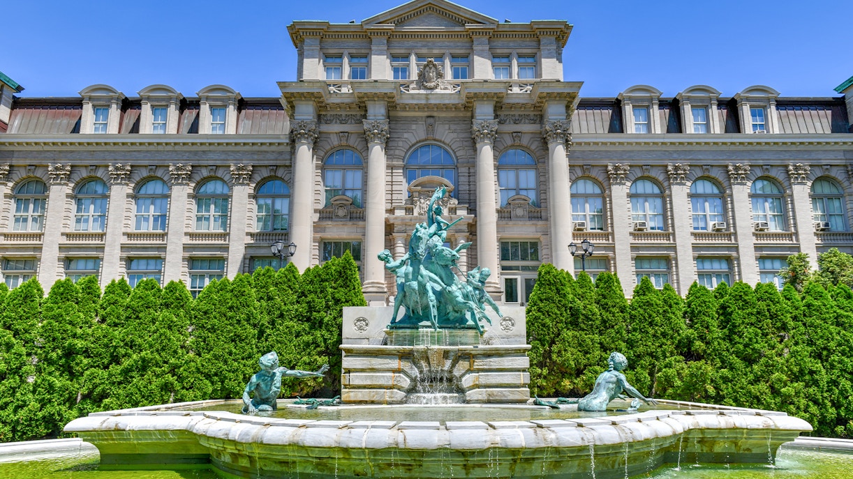 Fountain and statues in front of Mertz Library at New York Botanical Garden.