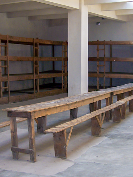 Wooden bunks and benches inside Terezin Concentration Camp.
