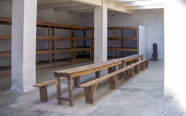 Wooden bunks and benches inside Terezin Concentration Camp.