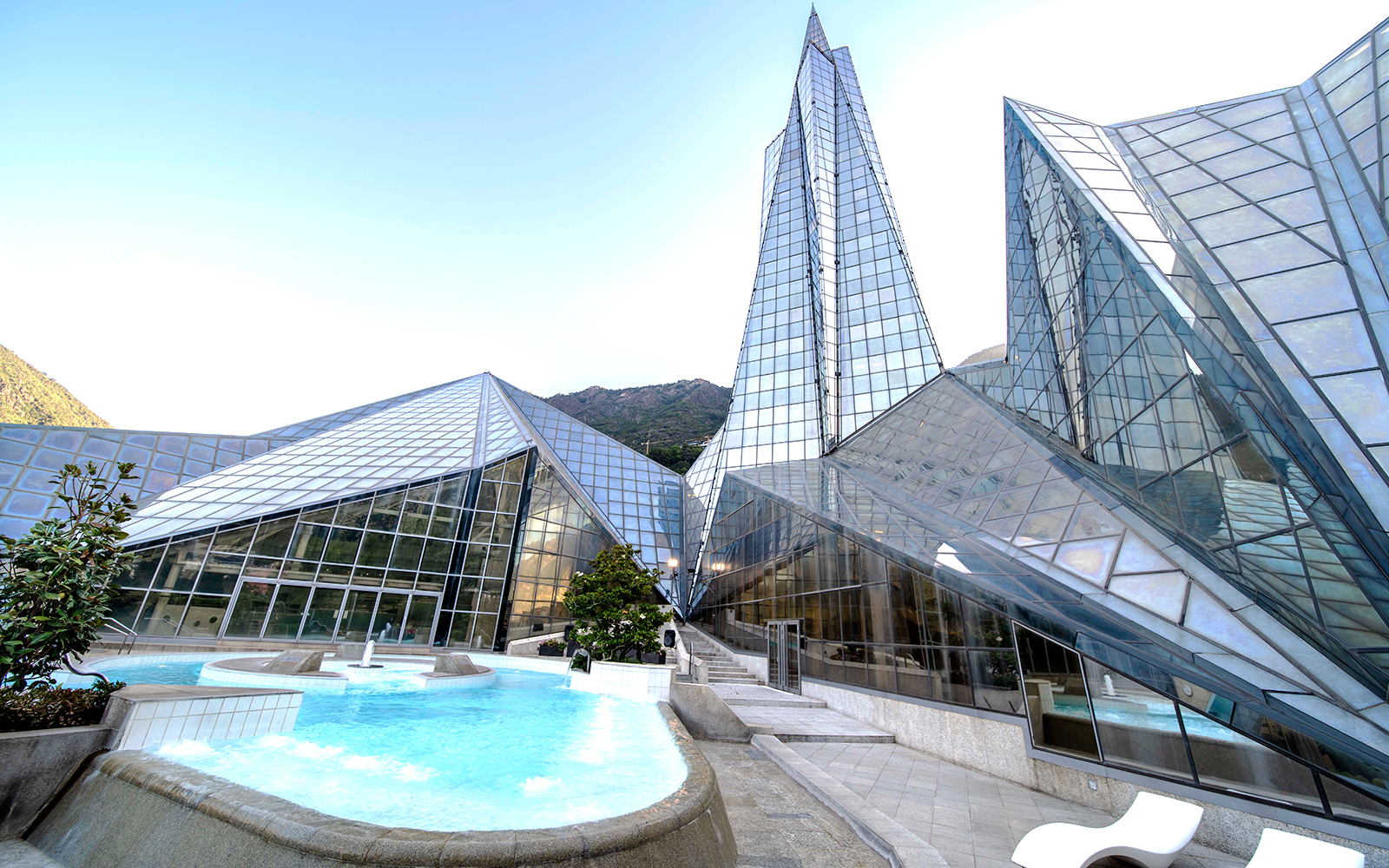 Outdoor thermal pool at Origins Terrace Caldea Spa in Andorra with mountain views.