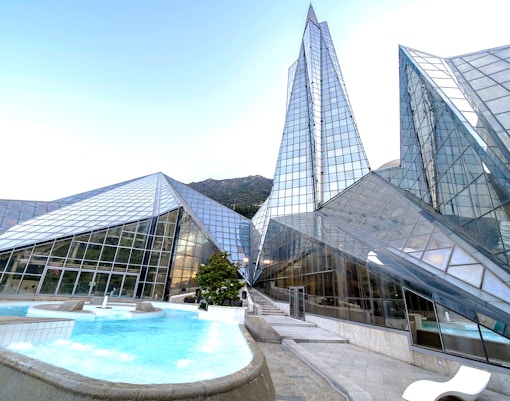 Outdoor thermal pool at Origins Terrace Caldea Spa in Andorra with mountain views.