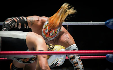 Wrestlers in action at Lucha Libre Arena Mexico.
