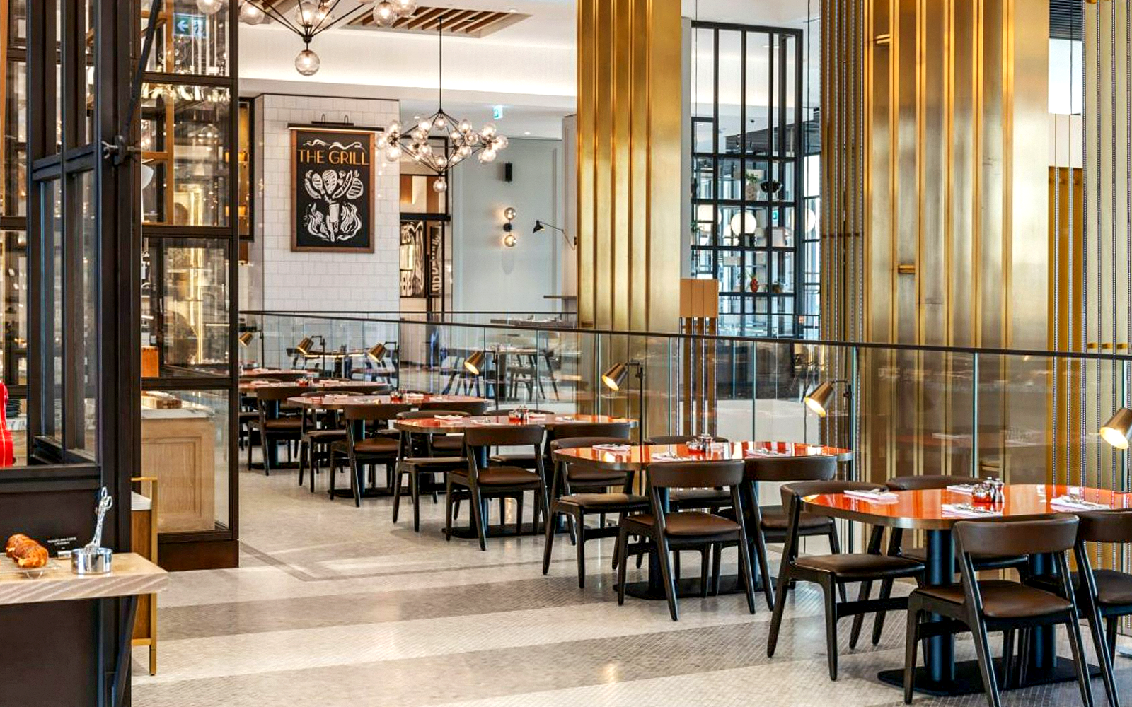 Dining area at Gastronomy, Dubai with modern decor and neatly arranged tables.