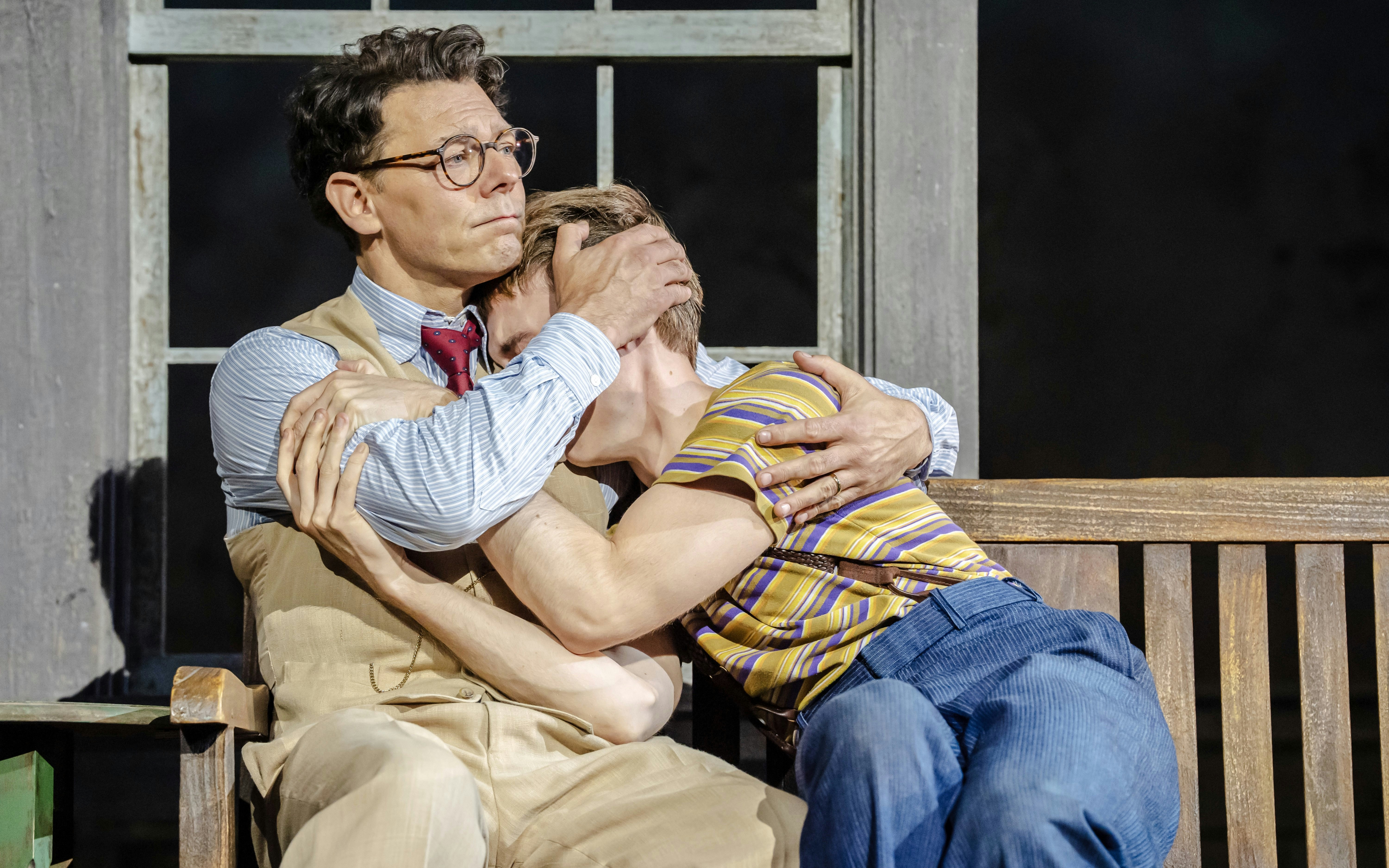 Actors embrace on stage during "To Kill a Mockingbird" West End show.