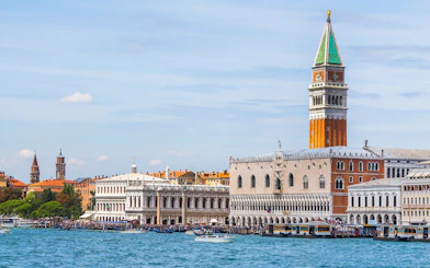 Doge's Palace and St. Mark's Campanile viewed from the water in Venice, Italy.