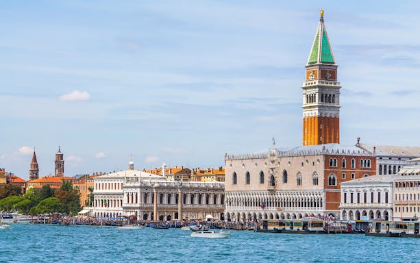 Doge's Palace and St. Mark's Campanile viewed from the water in Venice, Italy.