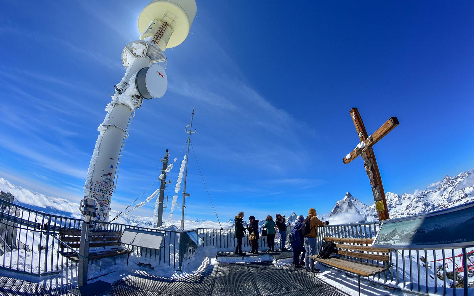 Klein Matterhorn observation deck with visitors and snowy mountain views.