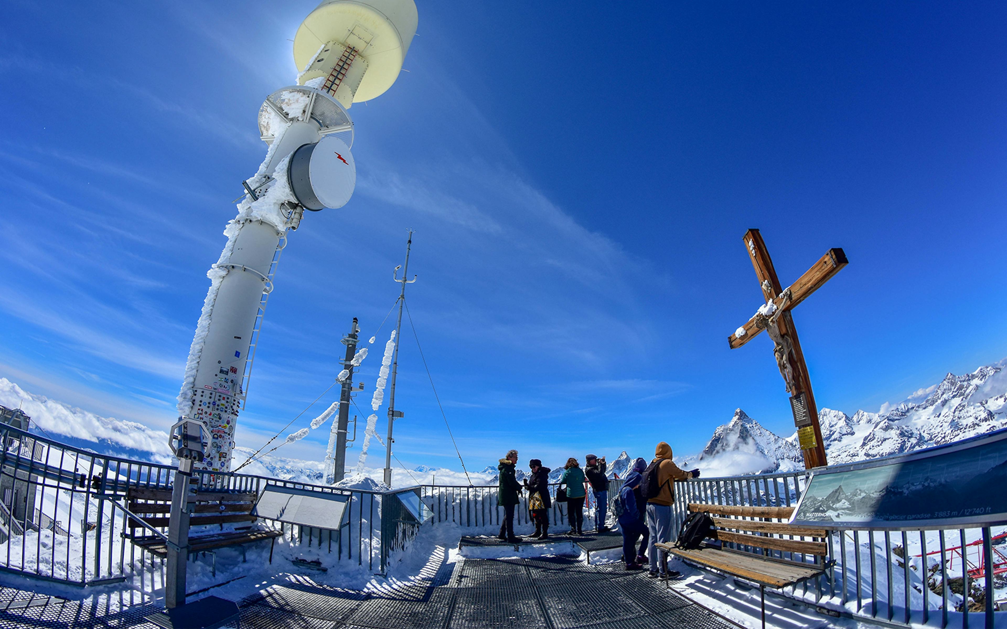 Klein Matterhorn observation deck with visitors and snowy mountain views.