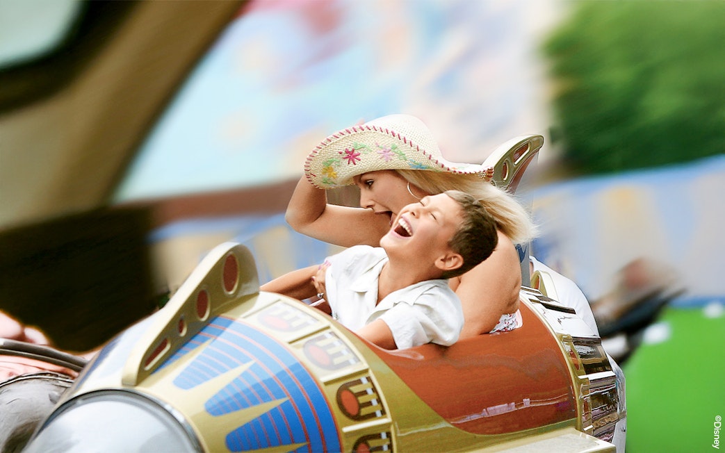 Guests enjoying a ride at Disneyland Park, California.