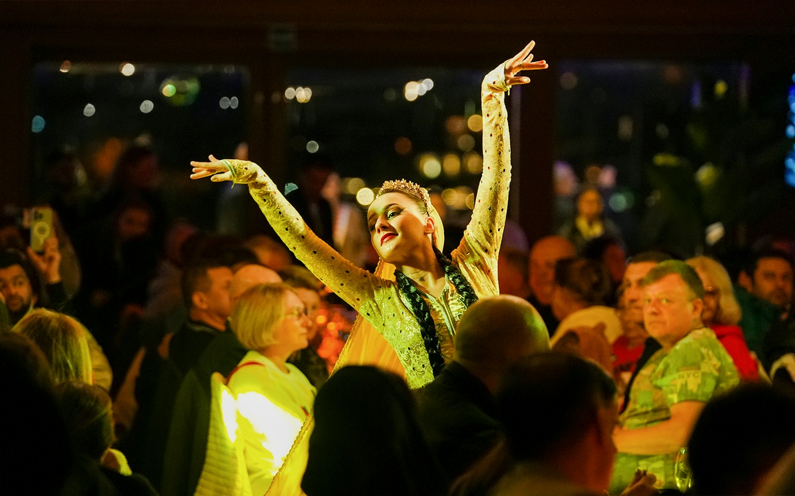 Bosphorus dinner cruise with live entertainment, Istanbul skyline in the background.