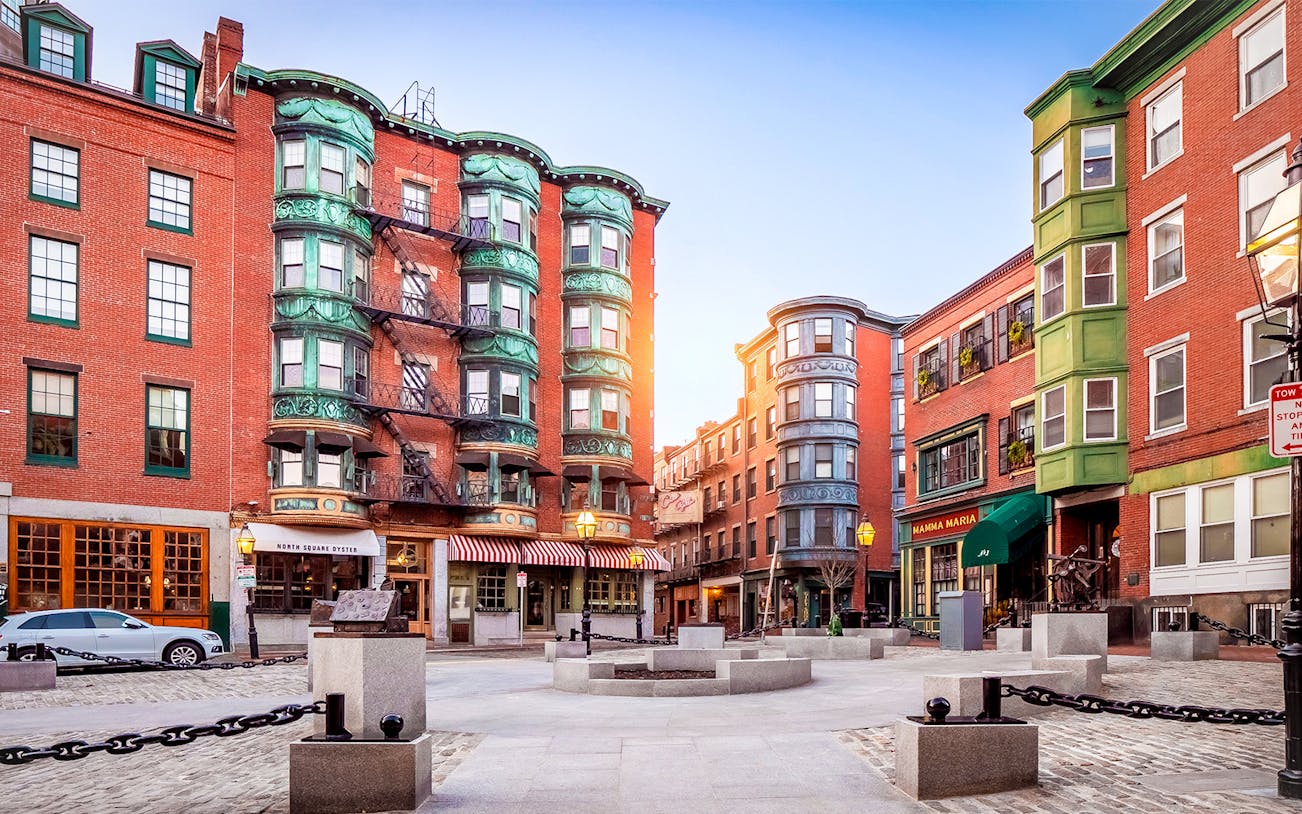Historic buildings in Boston's Little Italy street with North Square Oyster and Mamma Maria restaurants.
