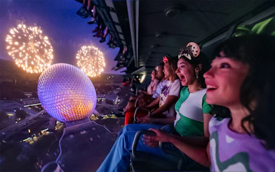 Guests enjoying fireworks from a ride at Mickey's Not-So-Scary Halloween Party, Walt Disney Resort, Orlando.