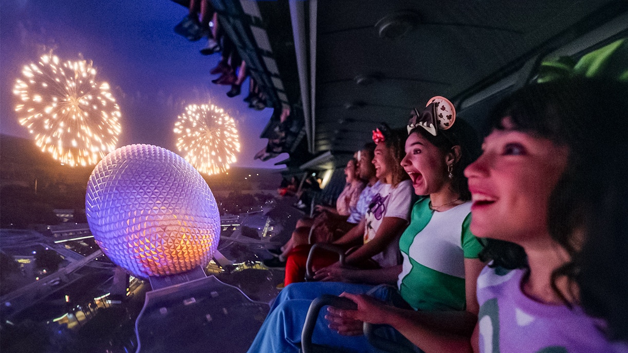 Guests enjoying fireworks from a ride at Mickey's Not-So-Scary Halloween Party, Walt Disney Resort, Orlando.