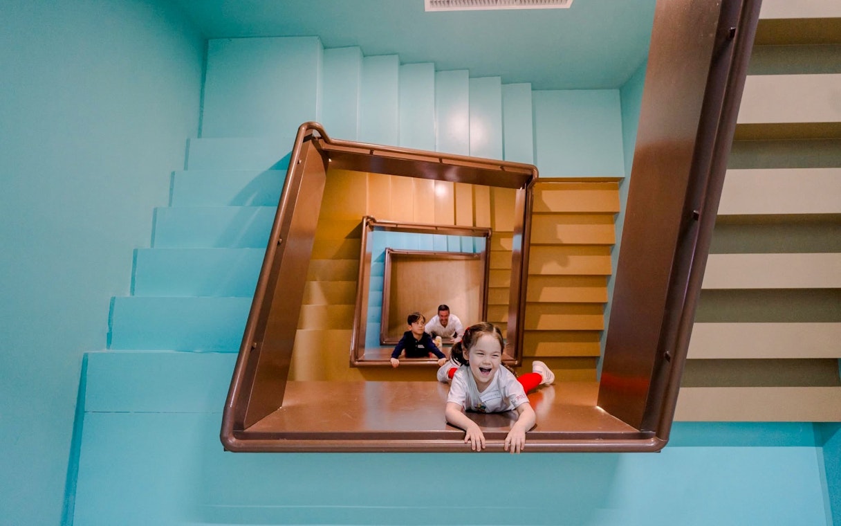 Children playing in the Space & Time Cube exhibit in Bangkok.
