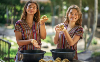 Visitors preparing food for elephants at Elephant Jungle Sanctuary Samui.