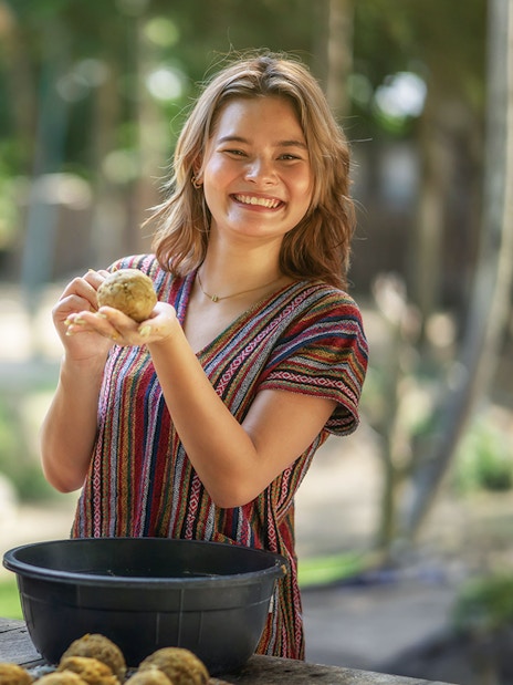Visitors preparing food for elephants at Elephant Jungle Sanctuary Samui.