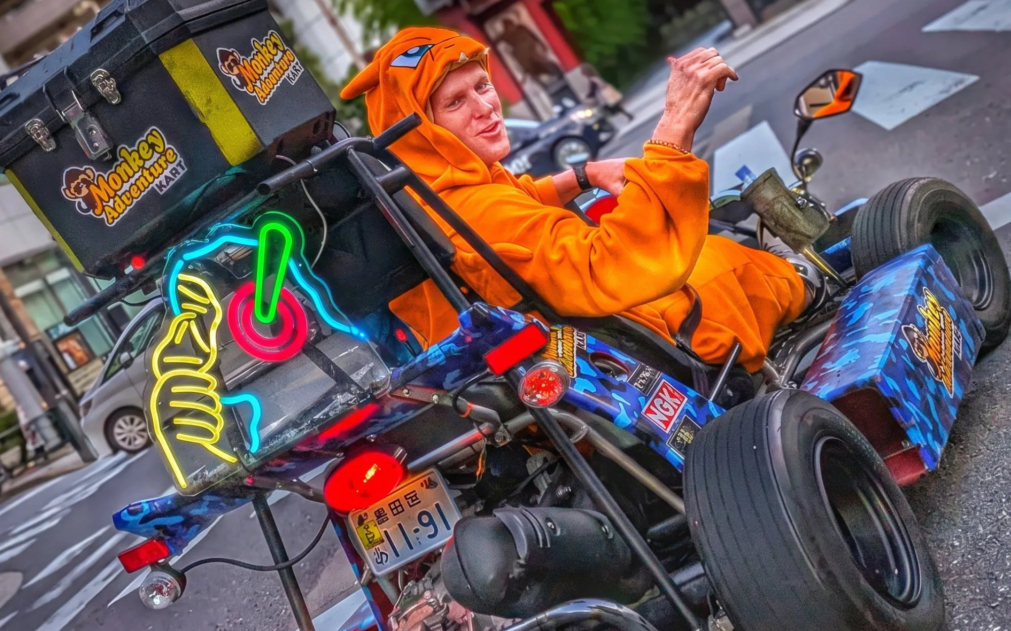 Go-kart rider in costume on street during Asakusa, Skytree & Akihabara go-karting experience.