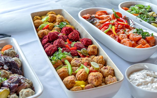 Buffet spread with assorted appetizers on Hamburg boat party.