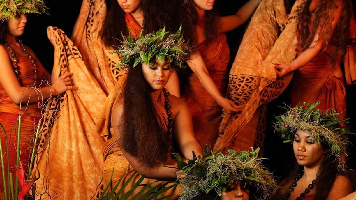 Dancers in traditional attire at Luau Kalamaku cultural show, Hawaii.