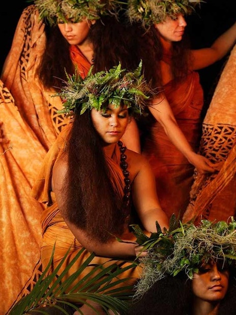 Dancers in traditional attire at Luau Kalamaku cultural show, Hawaii.