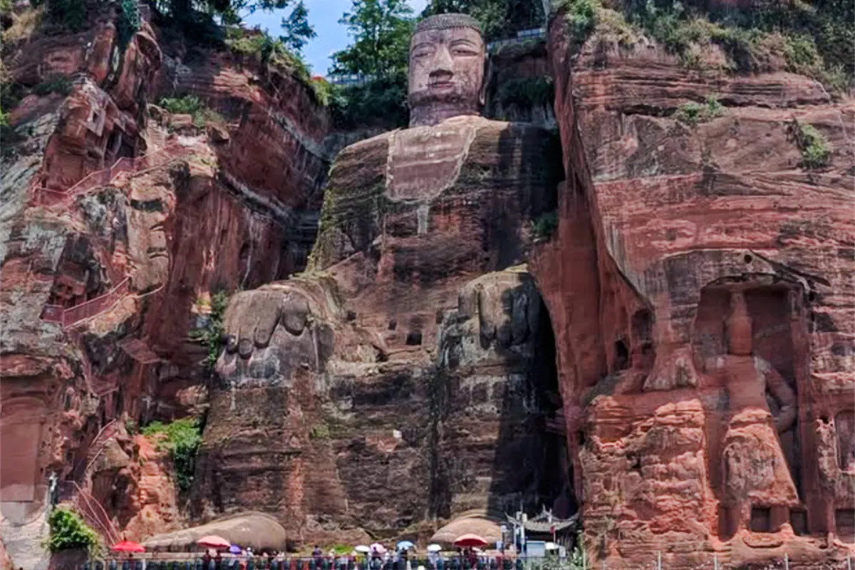 Leshan Giant Buddha carved into red cliffs, Chengdu.
