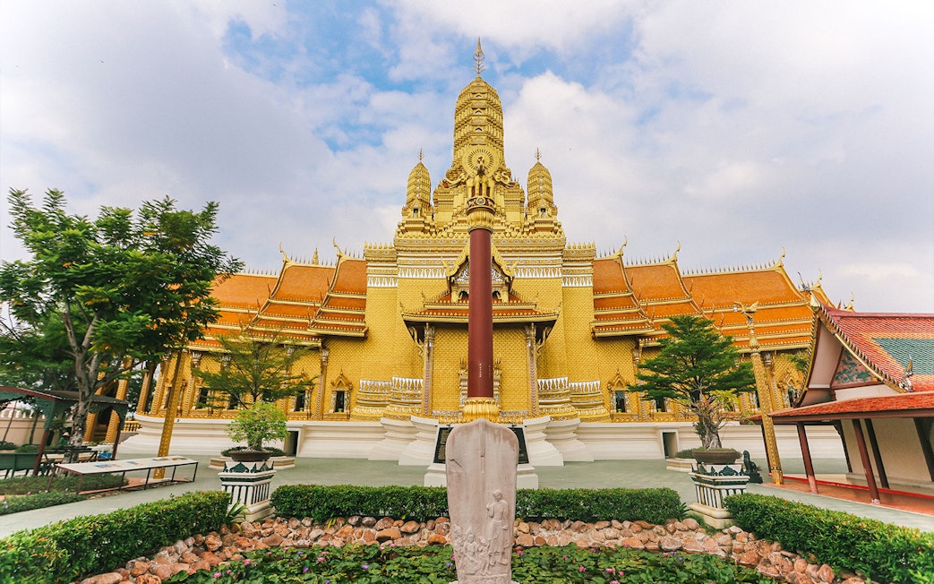 Golden temple facade at Ancient City, Thailand, featured on the Erawan Museum Guided Tour.