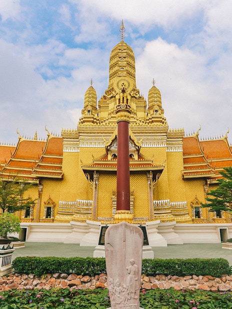Golden temple facade at Ancient City, Thailand, featured on the Erawan Museum Guided Tour.