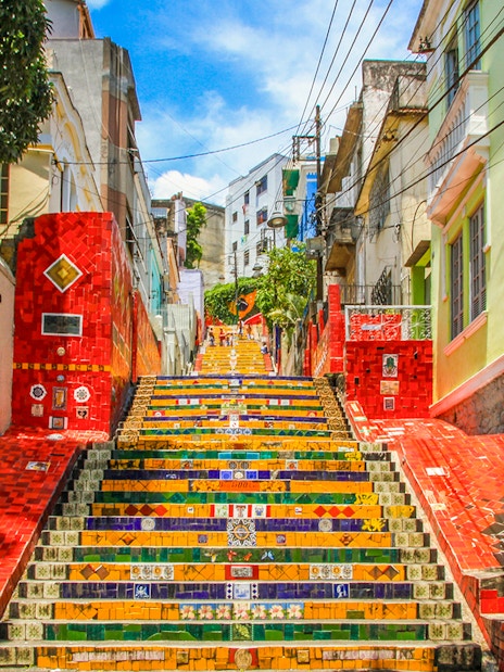 Escadaria Selarón in Rio de Janeiro, vibrant mosaic-tiled steps ascending between colorful buildings.