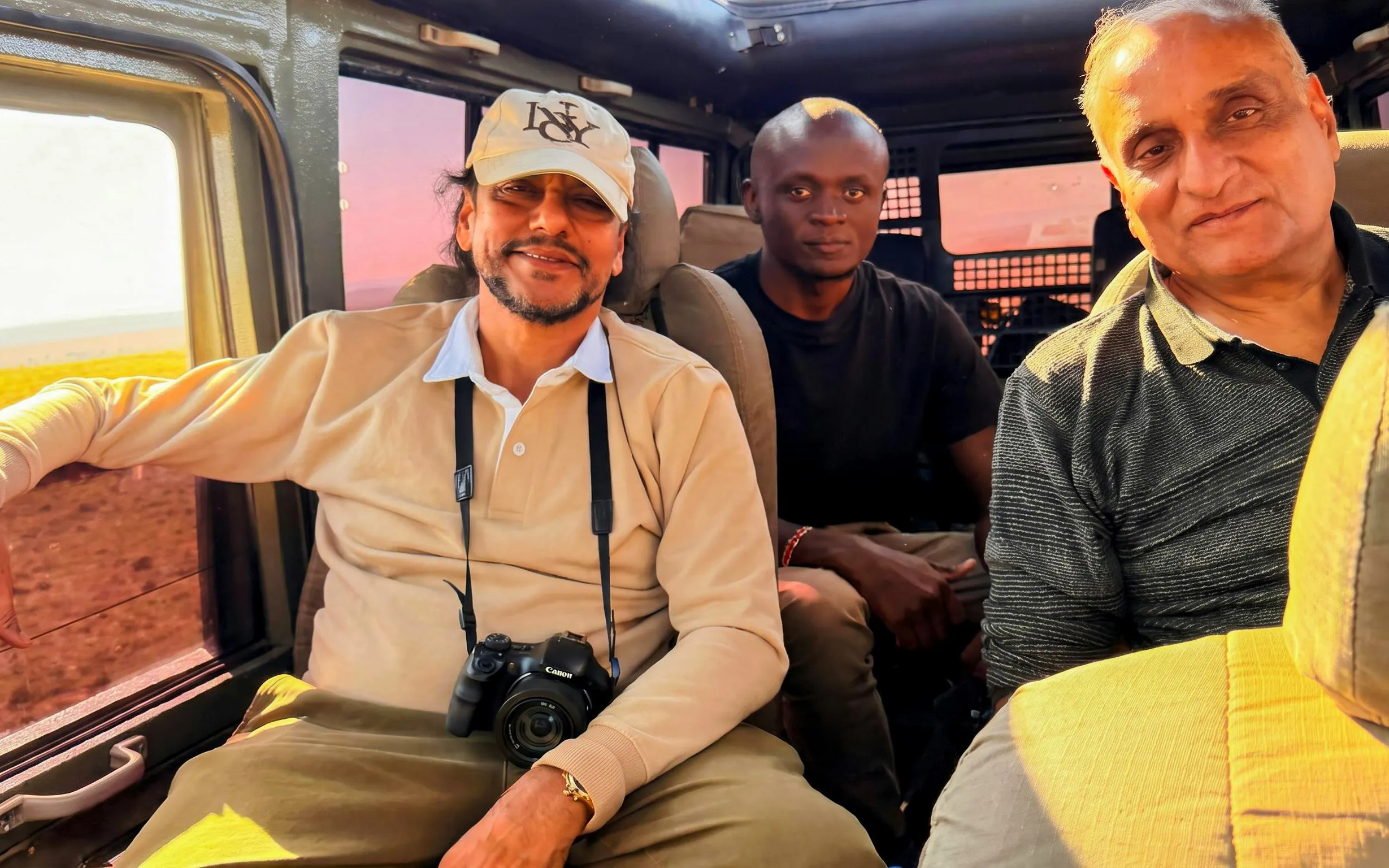 Tourists inside a safari vehicle during a Masai Mara Safari.