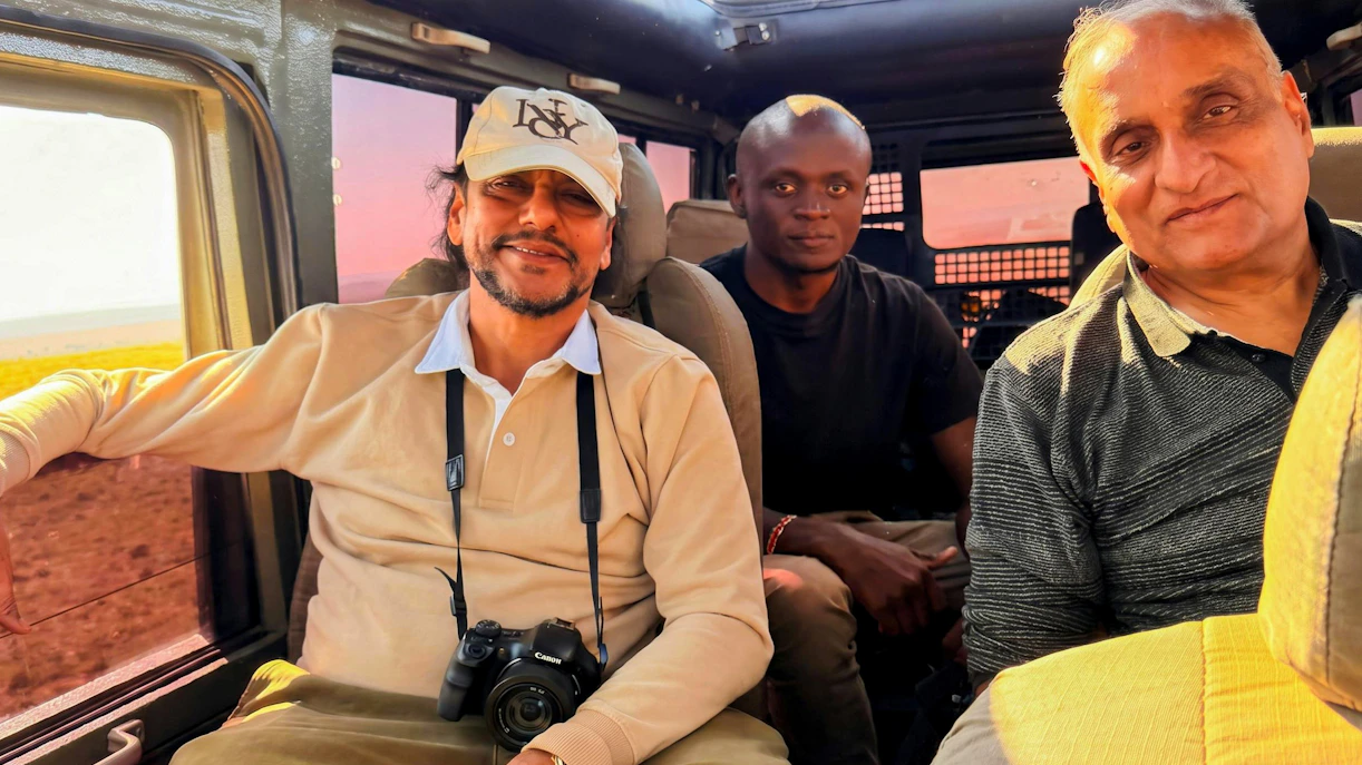 Tourists inside a safari vehicle during a Masai Mara Safari.