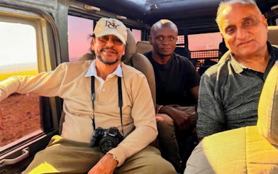 Tourists inside a safari vehicle during a Masai Mara Safari.