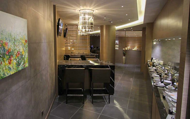 Plaza Premium Lounge interior with seating and buffet area.