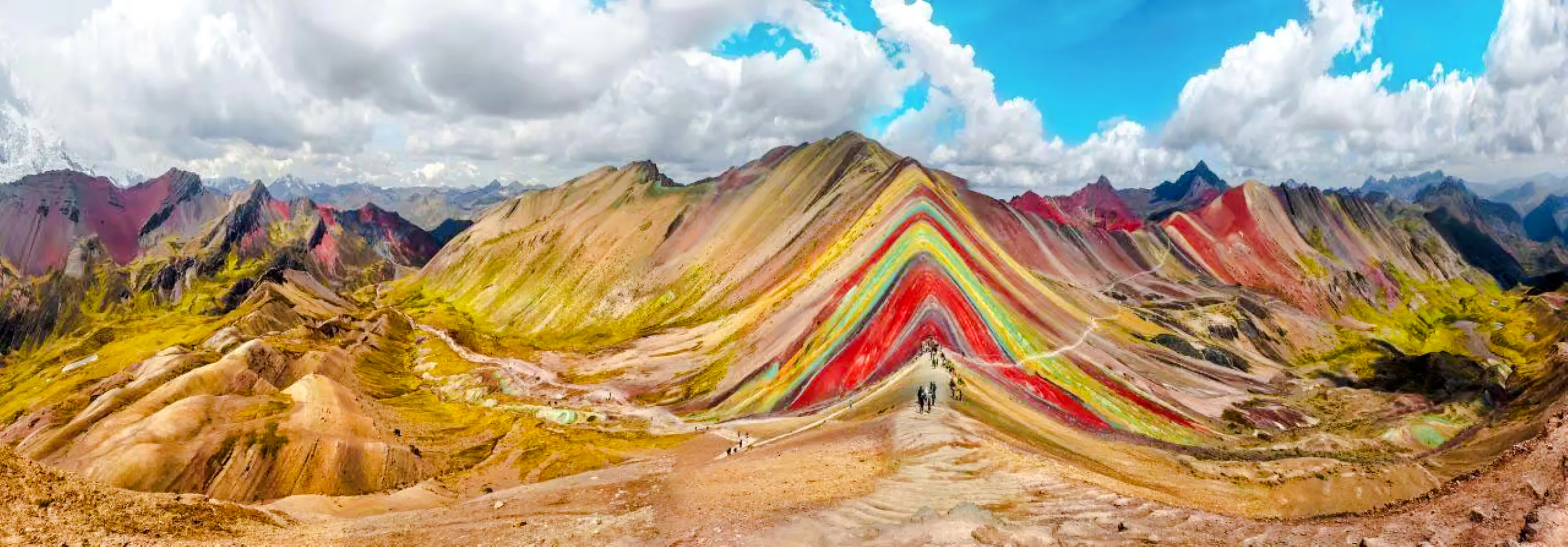Rainbow Mountain with hikers on trail, Cusco, Peru.